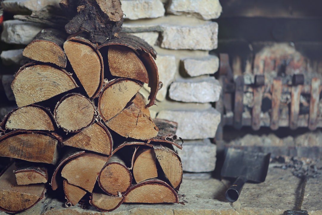An image showcasing a cozy living room with a crackling fireplace, where a stack of firewood transforms into neatly arranged wood briquettes, emitting a warm glow and casting dancing shadows on the walls